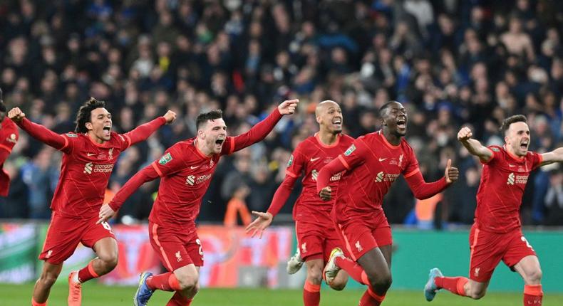 Liverpool players celebrate winning the League Cup final Creator: JUSTIN TALLIS