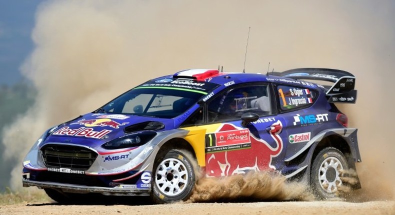 French driver and co-driver, Sebastien Ogier and Julien Ingrassia, steer their Ford Fiesta WRC in Amarante, northern Portugal, on May 20, 2017, during the SS12 stage of the Portugal WCR rally