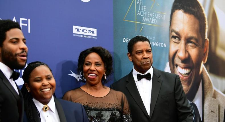 Denzel Washington (right, with his wife Pauletta and two of their four children, Malcolm and Katia) is one of only four black stars to win a best actor Oscar