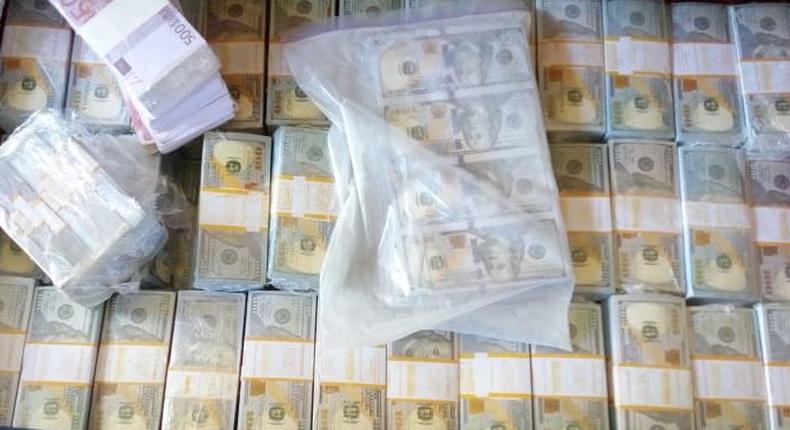 Fake dollars confiscated by DCI in Tuesday morning raid (Twitter)