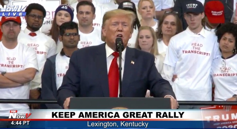 Trump speaks at a Kentucky rally in front of supporters with 'READ THE ...