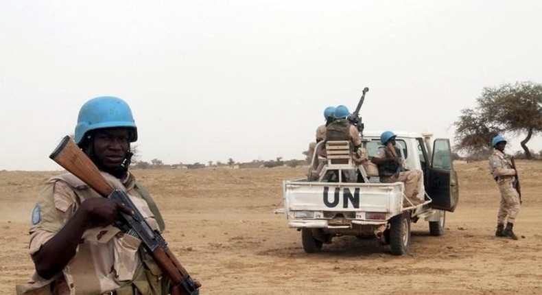 UN peacekeepers stand guard in the northern town of Kouroume, Mali, May 13, 2015. Kourome is 18 km (11 miles) south of Timbuktu. REUTERS/Adama Diarra