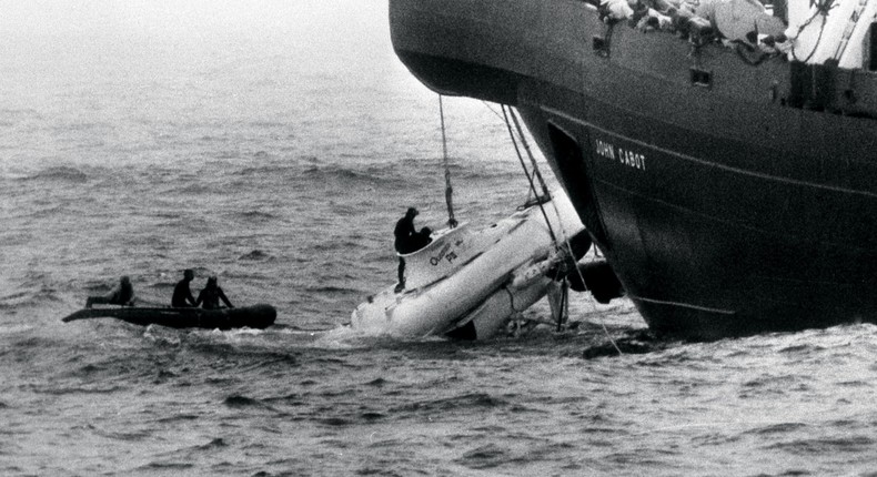 Divers begin to open the hatch of the miniature submarine Pisces III as she breaks water under the John Cabot after being hauled from the Atlantic seabed.PA Images via Getty Images