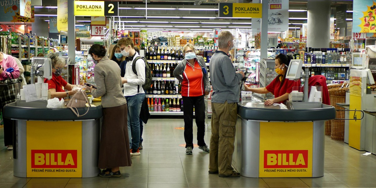 PRAGUE, CZECH REPUBLIC, JUNE 22, 2020: Coronavirus mask face cash register shopping carts food cente