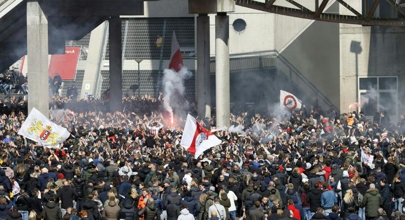 Ajax supporters gathered outside the Johan Cruyjff Arena as  their team clinched  the Dutch Eredivisie