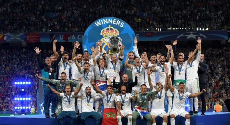 Sergio Ramos lifts last season's Champions League trophy alongside his Real Madrid teammates in Kiev