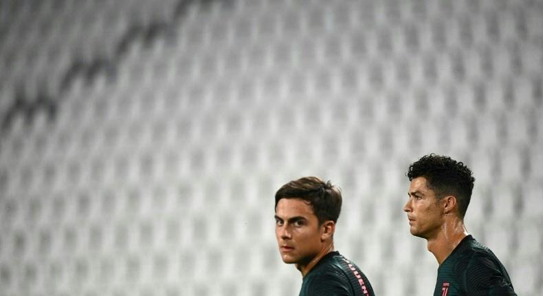 Paulo Dybala (L) and Cristiano Ronaldo (R) have been reported to prosecutors for breaking isolation.