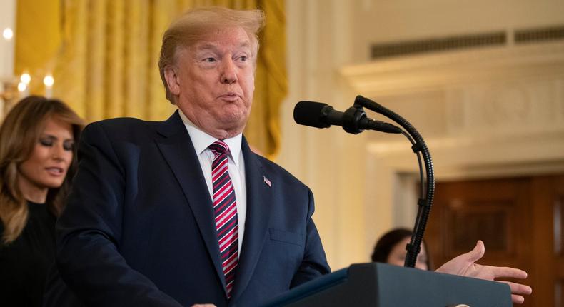 President Donald Trump with first lady Melania Trump, speaks during a Hanukkah reception in the East Room of the White House Wednesday, Dec. 11, 2019, in Washington. (AP Photo/Manuel Balce Ceneta)