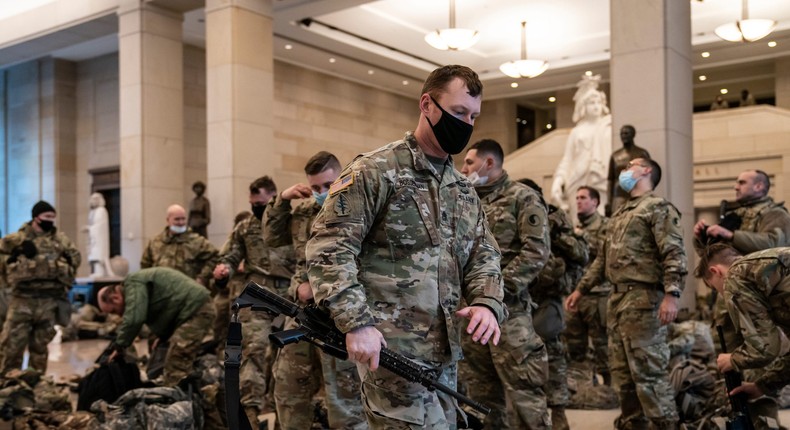 Armed military  in the Capitol.