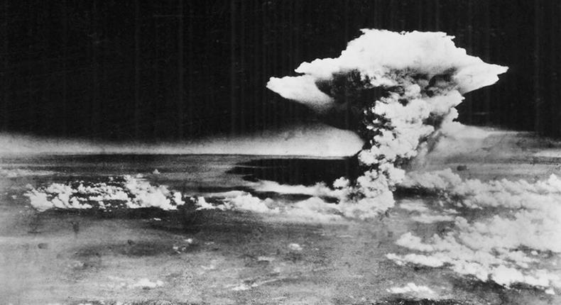 A mushroom cloud billows into the sky about an hour after an atomic bomb was dropped on Hiroshima, Japan.