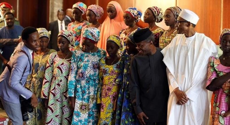 President Muhammadu Buhari and Vice President Yemi Osinbajo receive the 21 Chibok school girls released by Boko Haram, in Abuja, Nigeria October 19, 2016 REUTERS/Afolabi Sotunde