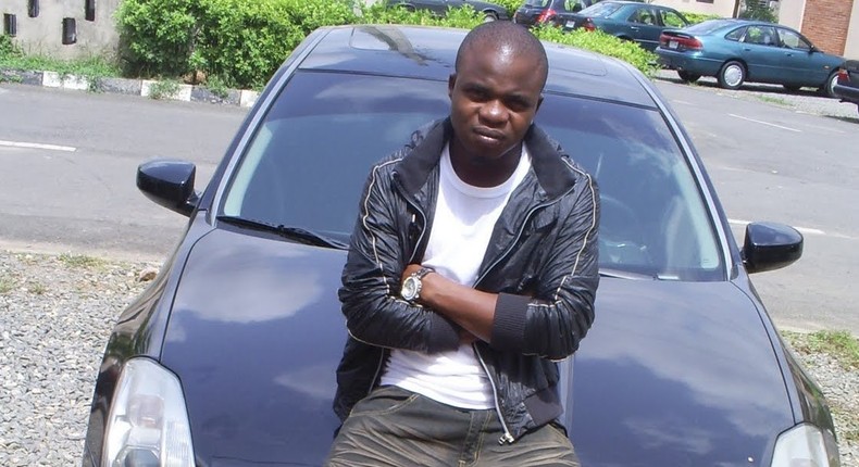 Dagrin sitting on his Nissam Maxima