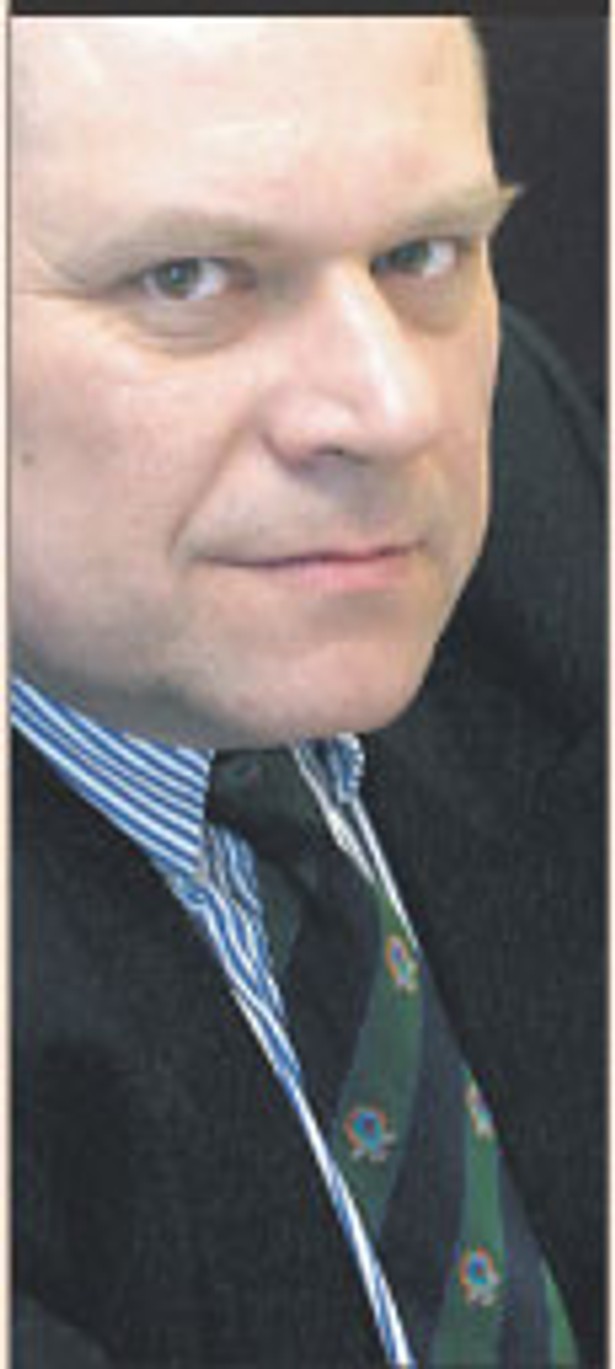 dr Janusz Fiszer, partner White & Case, docent UW