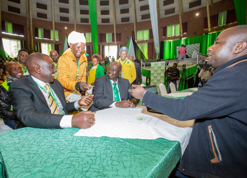 Pauline Waithera (white headscarf) and Calvince Okoth (behind DP Ruto) presented their Identity Cards in support of DP Ruto's candidature. The former was proposer while the latter was the seconder.