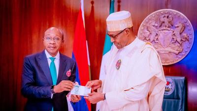 The redesigned notes launched in December 2022 with the backing of CBN governor, Godwin Emefiele (left), and President Muhammadu Buhari (right) [Presidency]