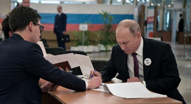 Putin (R) had endorsed the ruling party's candidate in the vote