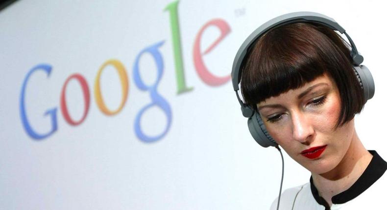 A woman listening to her headphones.