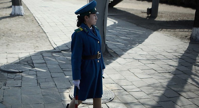 A young police woman conducts the traffic on April 2, 2011 in Pyongyang, North Korea.Feng Li/Getty Images