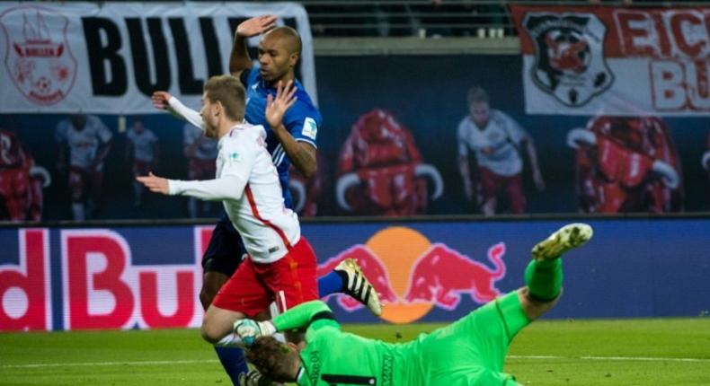 Leipzig's forward Timo Werner, Schalke's Brazilian defender Naldo and Schalke's goalkeeper Ralf Faehrmann vie for the ball during the German first division Bundesliga football match between RB Leipzig and Schalke 04 on December 3, 2016