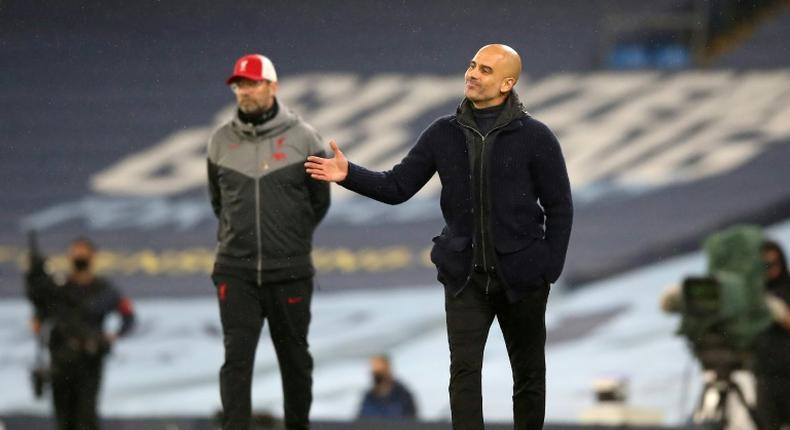 Manchester City boss Pep Guardiola (right) and Liverpool boss Jurgen Klopp shared the spoils in a 1-1 draw at the Etihad