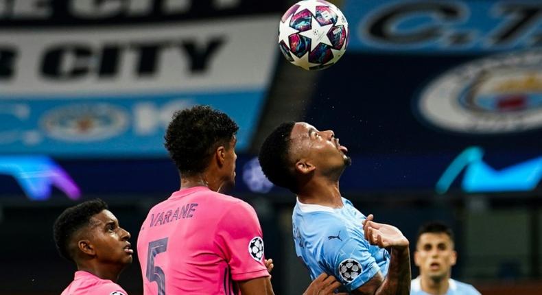 Gabriel Jesus made the most of two shocking mistakes by Raphael Varane, scoring one goal and creating another as Manchester City beat Real Madrid 2-1 to reach the Champions League quarter-finals 4-2 on aggregate on Friday