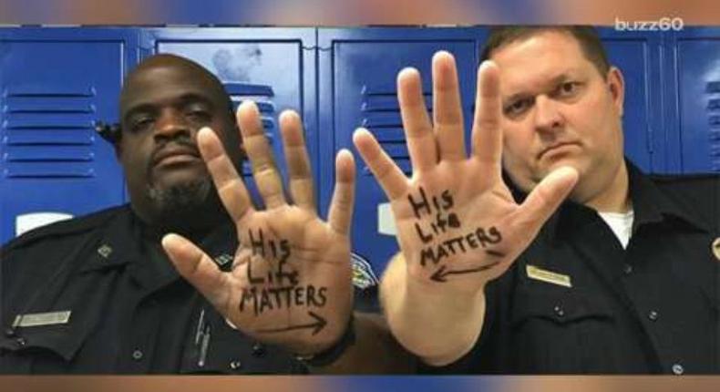 The Trinity Police Department shared a powerful photo of Chief Steven Jones and Officer Donald Givens, who are two different races, with His Life Matters written on the palm of their hands, each with an arrow pointed to the other.