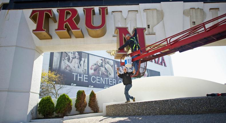 Signage from the Trump Plaza Casino in Atlantic City is removed after its closing in 2014.