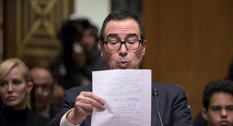 Treasury Secretary Steven Mnuchin goes over notes while testifying on Capitol Hill in Washington, Thursday, Jan. 19, 2017, at his confirmation hearing before the Senate Finance Committee.