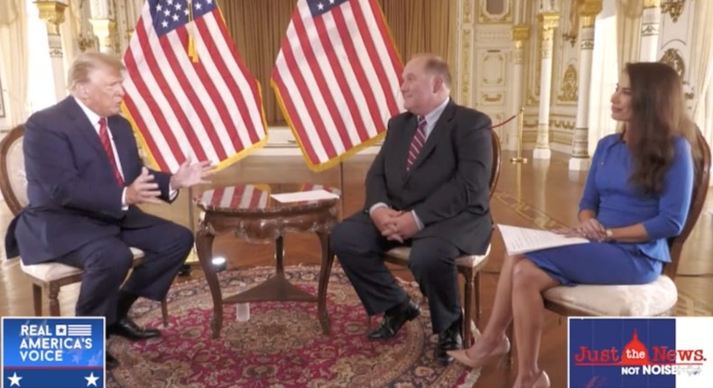 Former President Donald Trump is interviewed on Real America's Voice by hosts John Solomon and Amanda Head on March 29, 2022.