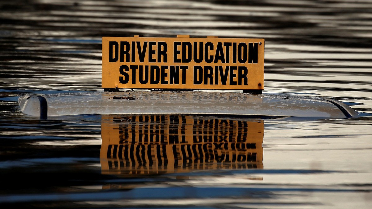 The roof a student driver car is pictured partly underwater as a result of Hurricane Matthew in Lumberton