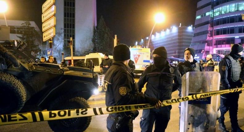 Turkish soldiers and policemen stand guard near the Cagdas Sanatlar Merkezi, a major art exhibition hall, where Andrei Karlov, the Russian ambassador to Ankara, was shot dead on December 19, 2016