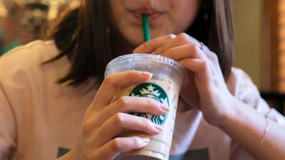Starbucks is dropping its surcharge for plant-based milk in the UK.