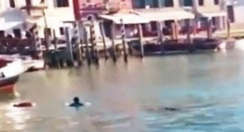 The African immigrant in Grand Canal in Venice