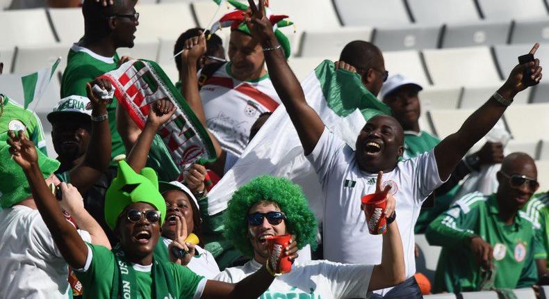 Nigeria's football supporters club jubilates at a stadium