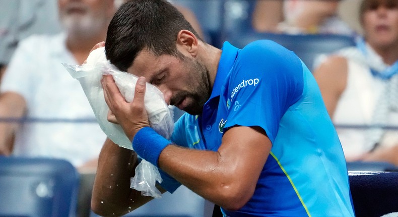 This year's US Open has been a hot one. Serbia's Novak Djokovic cooled off during a break this week.John Minchillo/Associated Press