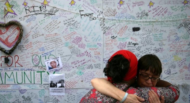 Pray For Our Community, reads one message on the wall of remembrance for victims of this week's London high-rise fire