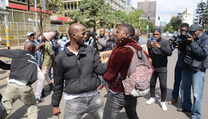 An undercover police officer arrests an activist within the Nairobi's Central Business District (CBD) during a demonstration against the Financial Bill 2023. Photo by John Ochieng