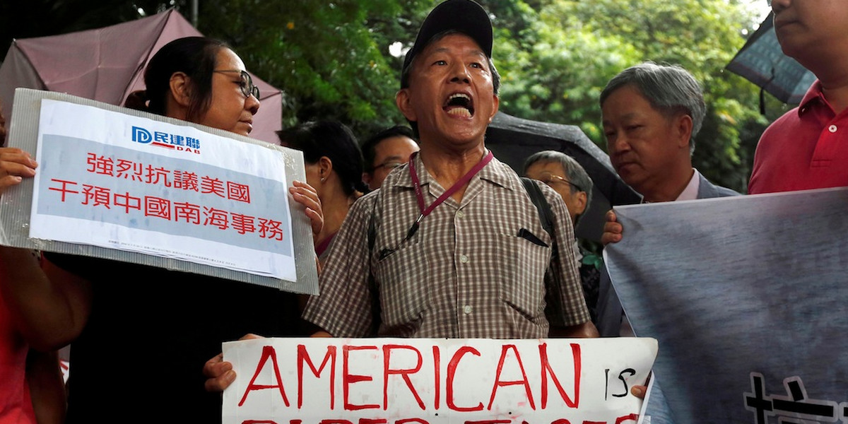 A protester chanting slogans against the US outside the US Consulate in Hong Kong on July 14 after an international court ruling denied China's claims to the South China Sea.