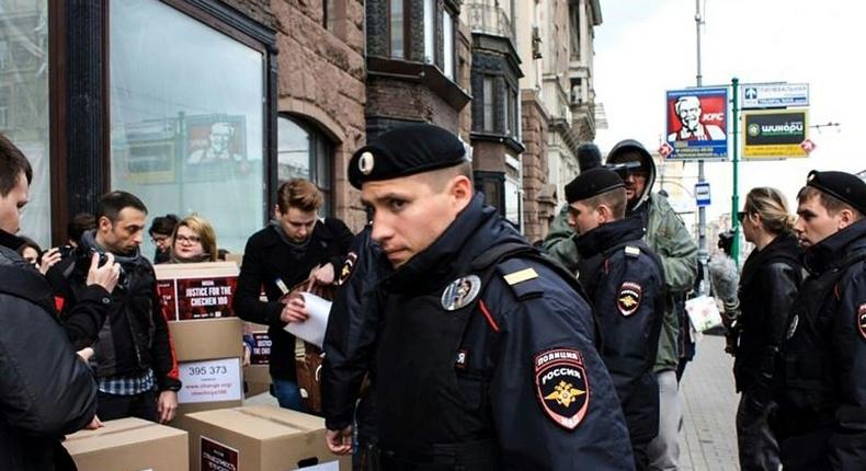 Russian policemen surround activists in central Moscow on May 11, 2017