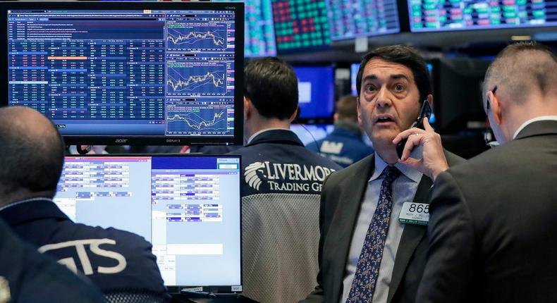 Traders work on the floor of the New York Stock Exchange (NYSE) in New York, U.S., March 20, 2020
