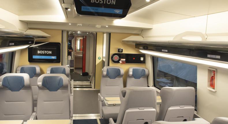 Each car will have 25% more seats than before, Amtrak says. Sleek new overhead luggage racks and digital signage add to the futuristic look.