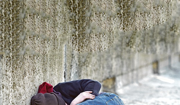 young-homeless-boy-sleeping-on-450w-412953637