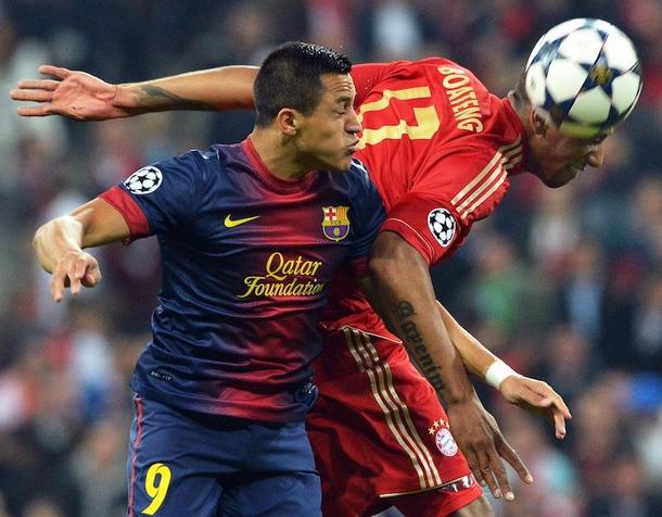 Jerome Boateng (R) in action against Barcelona's Alexis Sanchez bayern barcelona   PETER KNEFFEL