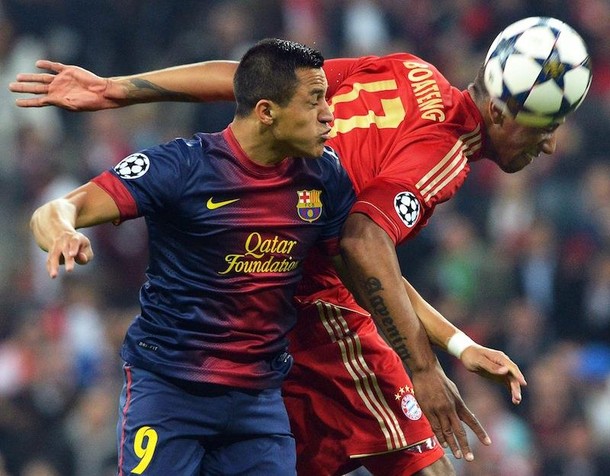 Jerome Boateng (R) in action against Barcelona's Alexis Sanchez bayern barcelona   PETER KNEFFEL