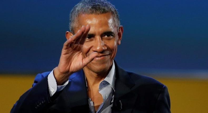 Former U.S. President Barack Obama waves after speaking at the Global Food Innovation Summit in Milan