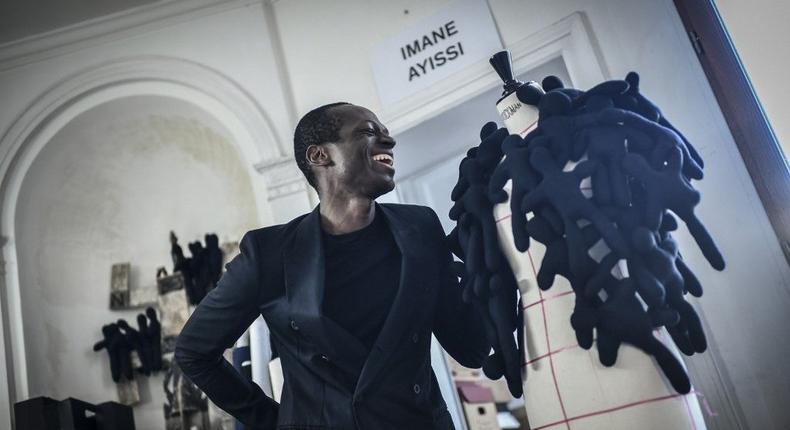 Cameroonian designer Imane Ayissi makes history by becoming the first sub-Saharan African designer to show in the Paris haute couture week (AP)