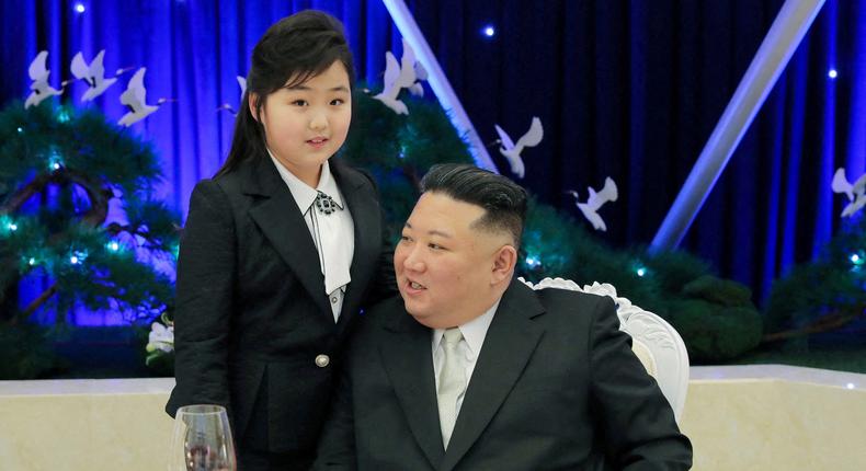 North Korean leader Kim Jong Un talks with his daughter Kim Ju Ae at a banquet to celebrate the 75th anniversary of the Korean People's Army the following day, in Pyongyang, North Korea February 7, 2023.KCNA via Reuters