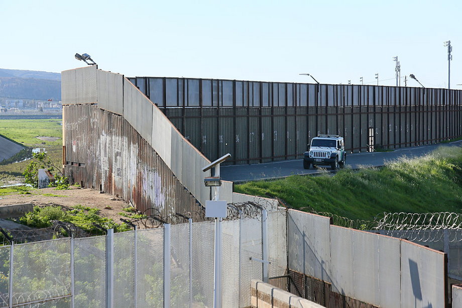 A border-patrol vehicle sits along the US-Mexico border wall on January 25, 2017, in San Ysidro, California.