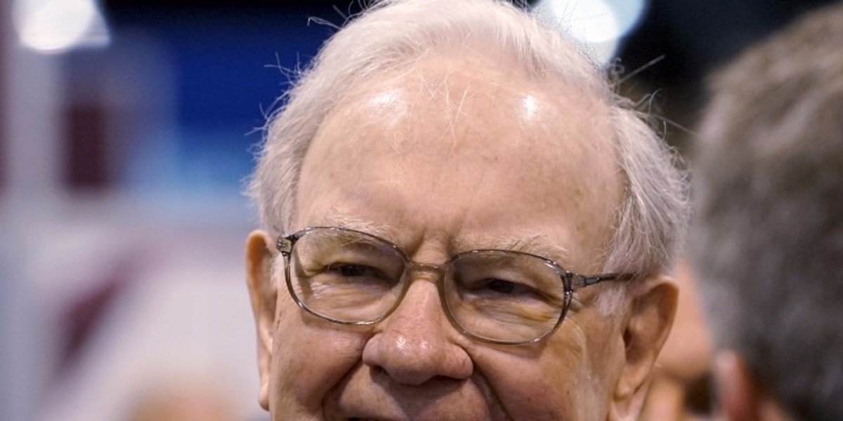 Berkshire Hathaway CEO Warren Buffett talks to reporters prior to the Berkshire annual meeting in Omaha