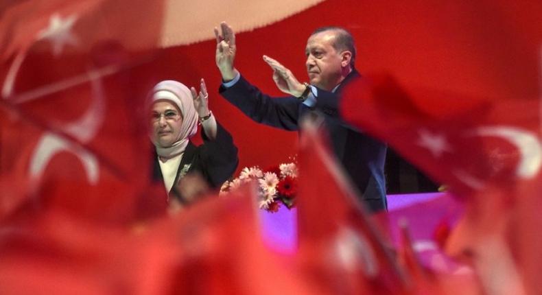 Turkish President Recep Tayyip Erdogan and his wife Emine Erdogan campaign at a rally on April 12, 2017